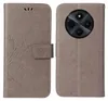 A flip phone case for a Xiaomi Redmi 14C is shown, featuring a floral and butterfly design. The case is open, revealing the inside and the back of the phone with its camera module. Produktbild-Vorschau