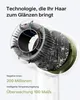 A close-up view of the internal components of a hair dryer, with text overlay describing its features. Voir les images du produit