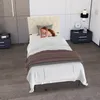 A woman sleeping in a bed in a bedroom. Produktbild-Vorschau