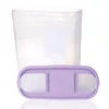 A clear plastic food storage container with a purple lid is shown against a white background. Anteprima dell’immagine prodotto