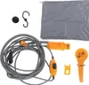 A collection of camping shower accessories laid out on a white background. Náhled obrázku produktu