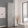 A tall, gray office cabinet stands next to a window with a computer on a desk. Produktbild-Vorschau