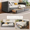 Collage of a grey upholstered daybed shown in different configurations, including with drawers pulled out and as an extended king-size bed. Voir les images du produit