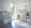 A modern bathroom with a toilet, bidet, and sink. Produktbild-Vorschau