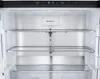 The interior of an empty LG refrigerator with shelves and a "Pure N Fresh" compartment. Produktbild-Vorschau