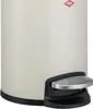 A close-up of a cream-colored pedal bin with a silver pedal and black base. Produktbild-Vorschau