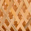 A close-up view of a woven bamboo lampshade. Produktbild-Vorschau