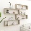Several wooden cube shelves are mounted on a white wall, decorated with various items. Náhled obrázku produktu