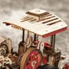A close-up view of a wooden model steam engine, focusing on the driver's cabin and roof. Produktbild-Vorschau