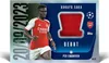 A trading card featuring a soccer player, Bukayo Saka, with a piece of his jersey embedded in it. The card also includes game details and logos. Náhľad obrázku produktu