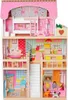 A multi-story wooden dollhouse with furniture and dolls. Produktbild-Vorschau