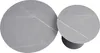 Two round coffee tables of different sizes, made of gray sintered stone with white veining, placed on white background. The smaller table has a black conical base. Produktbild-Vorschau