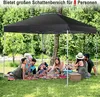A family is having a picnic under a black pop-up gazebo in a grassy park with trees in the background. Produktbild-Vorschau