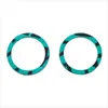 Two teal and black striped rings are shown against a white background. Produktbild-Vorschau