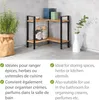 A corner shelf unit with items on it, next to a potted plant and a vase. Produktbild-Vorschau