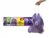 A hand holding a purple trash bag filled with trash, next to a roll of trash bags. Náhled obrázku produktu