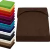 A stack of colorful fitted sheets and a single brown fitted sheet. Produktbild-Vorschau