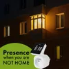 A digital timer plugged into a wall socket, with a building facade in the background at night. Náhľad obrázku produktu