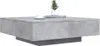 A modern, square coffee table with a concrete-like finish, featuring a small potted plant and a coffee cup on top. Podgląd zdjęcia produktu