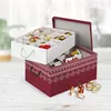 Two Christmas decoration storage boxes are shown, one stacked on top of the other. The top box is white with dividers and contains Christmas ornaments. The bottom box is red with a snowflake pattern and is open, revealing more ornaments and small decorativ Produktbild-Vorschau
