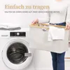A person is holding a laundry basket next to a washing machine. Náhľad obrázku produktu