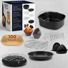 A collection of air fryer accessories and packaging, including a baking pan, racks, silicone liners, and paper liners. Podgląd zdjęcia produktu