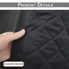 A hand is holding a black quilted fabric, likely a curtain, showing its texture and stitching. Voir les images du produit