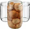 Three glass jars, one filled with mushrooms and two empty, are arranged on a white background. Podgląd zdjęcia produktu