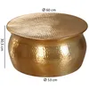 A gold hammered metal coffee table with dimensions indicated. Produktbild-Vorschau