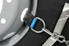 A close-up view of a snow chain attached to a tire and wheel rim. Produktbild-Vorschau