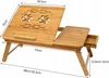 A wooden laptop table with dimensions shown. Produktbild-Vorschau