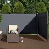 A patio scene with outdoor furniture and a retractable side awning. Anteprima dell’immagine prodotto
