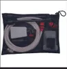 A black mesh bag containing various cleaning accessories, including hoses and nozzles. Produktbild-Vorschau