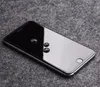 A smartphone with water droplets on its screen, placed on a textured gray surface. Voir les images du produit