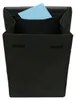 A black shopping trolley with a blue piece of paper sticking out of the top. Voir les images du produit