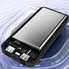 A power bank with its internal components exposed, resting on a translucent blue and white wavy surface. Produktbild-Vorschau