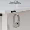 Close-up of a white desk with headphones hanging on a hook, and a control panel attached to the underside. Náhled obrázku produktu