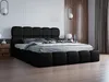A black upholstered bed with a tufted headboard and footboard is shown in a modern bedroom setting. Produktbild-Vorschau