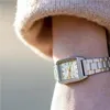 A close-up shot of a woman's wrist wearing a silver and gold Casio watch. Podgląd zdjęcia produktu