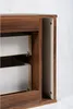 Close-up view of the interior of a dark brown cabinet, showing two white drawers with visible drawer slides. Náhled obrázku produktu