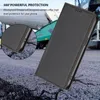 A black flip phone case is shown on a textured, cracked ground with a blurred industrial background. Produktbild-Vorschau
