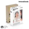 A product box for an LED tabletop mirror, with a cardboard box behind it. Produktbild-Vorschau