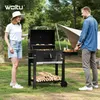 A couple is enjoying a barbecue in a park setting with a tent in the background. Produktbild-Vorschau