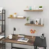 A home office setup with a desk, shelves, and decorative items. Produktbild-Vorschau