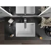 A top-down view of a modern bathroom vanity with two sinks and faucets, decorated with dried flowers and a candle. Podgląd zdjęcia produktu