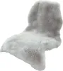 A fluffy, light gray faux fur rug is shown against a white background. Náhled obrázku produktu