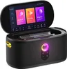 A karaoke machine with microphones inside, open lid showing the screen with apps. Produktbild-Vorschau