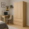 A bedroom or office setting with a wardrobe, desk, and bed. Voir les images du produit