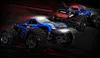 Two blue remote-controlled monster trucks are shown in a dynamic, dark setting with red accents. Voir les images du produit