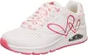 A white Skechers sneaker with pink heart accents and laces, shown from the side. Voir les images du produit